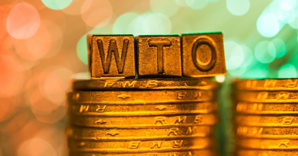 WTO Trade Facilitation Agreement - WTO text with coin in gold color